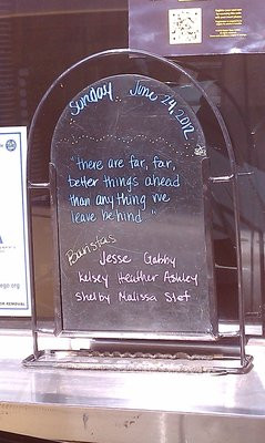 Cute sayings + trivia on the order window chalkboard
