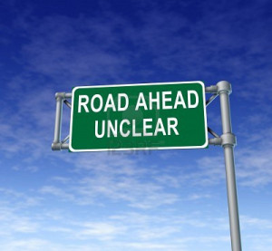 11405182-road-ahead-unclear-green-freeway-sign-representing ...