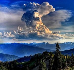 Storm clouds form over the spring Cascade mountains of Washington ...