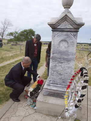 US Attorney General Eric Holder laying a wreath at the site of the ...