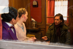 Tony Revolori, Saoirse Ronan and Wes Anderson on the set of 