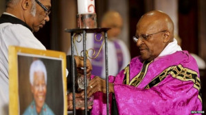 Archbishop Desmond Tutu, a friend of the late Nelson Mandela, prays ...