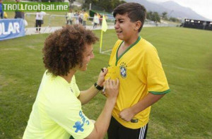 David Luiz signing the shirt of young fan, Daniel who was crying to ...