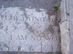 ... words are cut short by the walls of the Salem Witch Trials Memorial