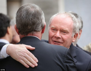 ... , hugged and spoke to Martin McGuinness outside St Margaret's Church