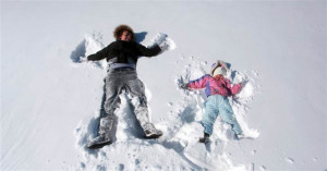 Hayley Smyers, 14, and Olivia Lutes, 3, make snow angels in Hutchinson ...