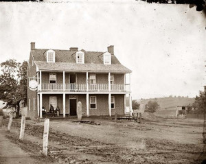The photograph, taken by James F. Gibson, is of the Farmer's Inn and ...