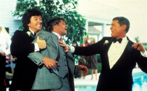JR Ewing (Larry Hagman) punches his rival Cliff Barnes (Ken Kercheval ...