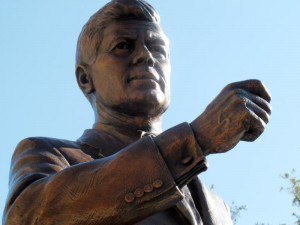 bronze statue of president john f kennedy stands in