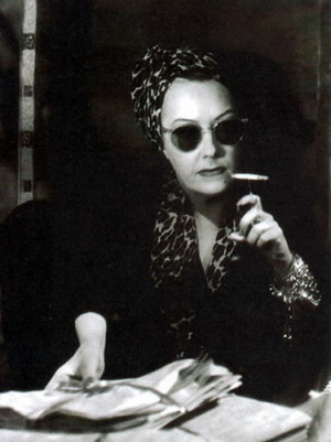 ... her cigarette clamped in a curious holder i could sense her eyes