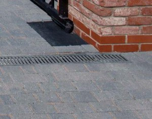 ... porous or permeable surface material which allows water to drain