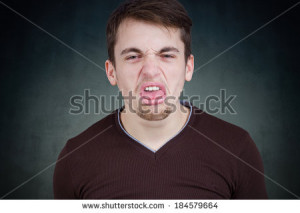 ... portrait, funny annoyed young childish rude bully man sticking