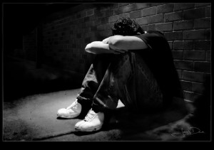 Depressed Boy on Wall by DepressionProject