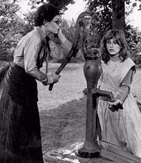 ... Sullivan (Bancroft) at the water pump with Helen Keller (Patty Duke