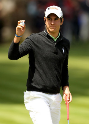 Matteo Manassero of Italy tees acknowledges the crowd on the 18th ...
