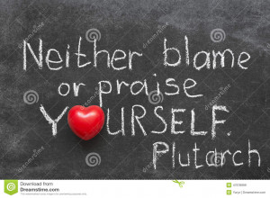 ... quote about praise or blame yourself handwritten on blackboard