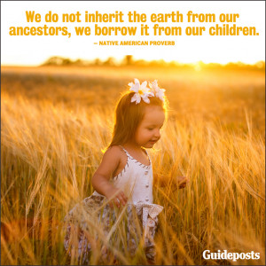 young girl standing in a sun-drenched field, with Earth Day quote