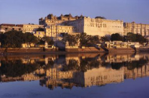 Grand Palace Reflected in the River Ganges, Udaipur, Rajasthan, India ...