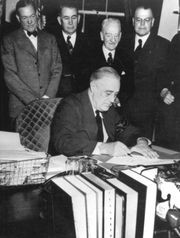 President Franklin D. Roosevelt signs the declaration of war against ...