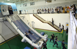 Korean Air Lines flight attendants undergo evacuation training at the