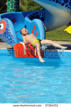 Stock Photo Cute And Funny Little Boy Sliding Down A Water Slide