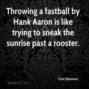 Throwing a fastball by Hank Aaron is like trying to sneak the sunrise ...