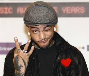 Travis McCoy of Gym Class Heroes poses on the red carpet before the ...