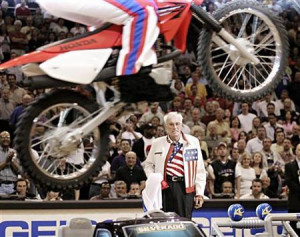 Former motorcycle daredevil Evel Knievel, watches as a person dressed ...