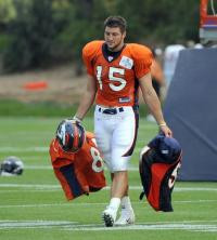 Tim Tebow's heavy workload at Broncos training camp includes carrying ...