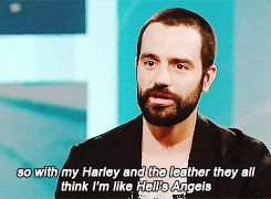 Ramin Karimloo driving his Harley in England.