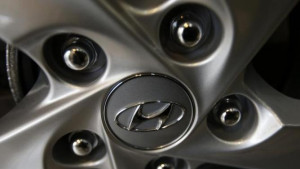 The logo of Hyundai Motor Co. is seen on a wheel of a car at a Hyundai ...