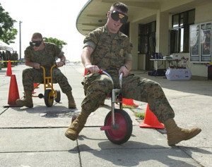 Foster military police attempt to race through an obstacle course