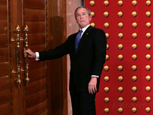 President George W. Bush as He Tries to Open a Locked Door Leaving a ...