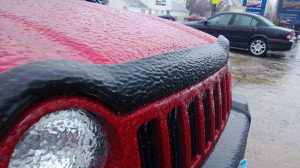 freezing rain resulted in a solide layer of ice covering every car