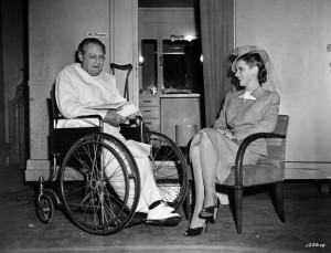 Lionel Barrymore and Susan Peters go over their lines on the set of Dr ...