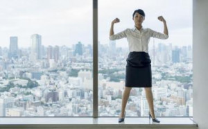 Business woman flexing muscles with city view. - Petri Artturi ...