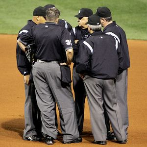 Umpire Huddles=Baseball Tradition