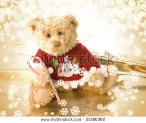 very cute teddy bear wearing Christmas sweater - stock photo