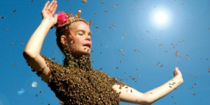 Her torso covered with bees, a dancer performs in “Queen of the Sun ...