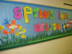 Spring Into Health bulletin board. Cheap slinkies on the letters ...