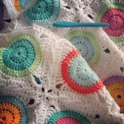 crocheting the last row of circles - Gumball Baby Blanket #crochet # ...