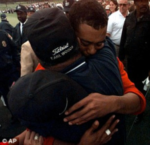 Comfy fit: Tiger is handed the famous Green Jacket by 1996 winner Nick ...