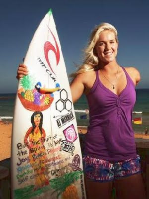 Bethany Hamilton standing with surfboard. Digital image. By 58 ...