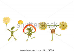 Healthy eating. Funny little people of the kiwi slices. - stock photo