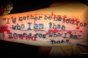 than living for false impressions says this arm quote tattoo styled ...
