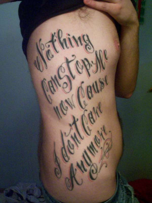 Family Quote Tattoos Ribs Black ink quote tattoo on man