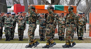 Soldiers carry coffin of Col MN Rai during a wreath laying ceremony at ...