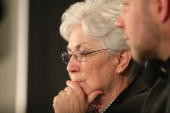 Gail Miller looks on with her son Roger Miller during a press