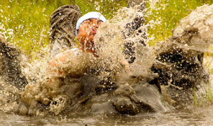 mud run team member takes a dive