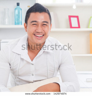 Good looking young Asian man smiling happy. Lifestyle Southeast Asian ...